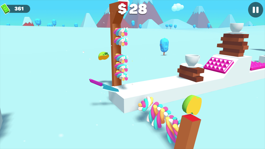 Rozgrywka w Slice Master: nóż kroi kolorowe cukierki obok kubków i platform.