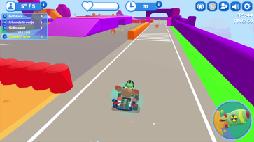 Smash Karts player driving along a colorful track toward weapon boxes and obstacles